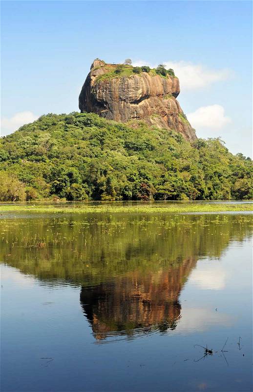 2040379-965532-sigiriya-lion-s-rock-is-an-ancient-rock-fortress-and-palace-ruin-of-sri-lanka-surrounded-by-the-remains-of-an-extensive-network-of-gardens-reservoirs-and-other-structures-a-popular-tourist-destination-sigiriya-is-also-renowned-for-its-ancient-painti.jpg